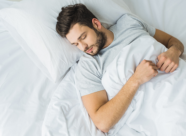 man sleeping in bed