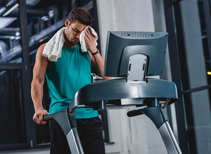 gym-goer working out on treadmil