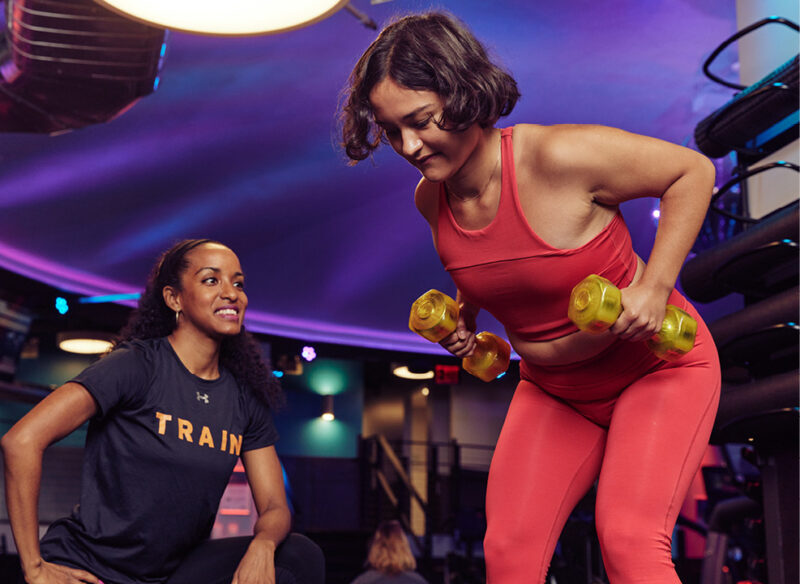woman with crunch personal trainer