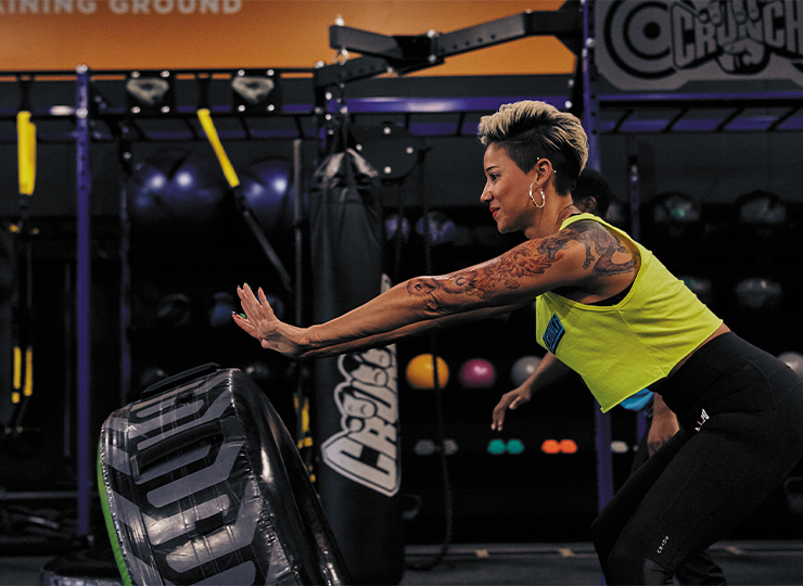 gymgoer working out with tire