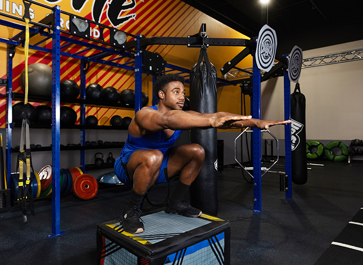gym-goer practicing squats