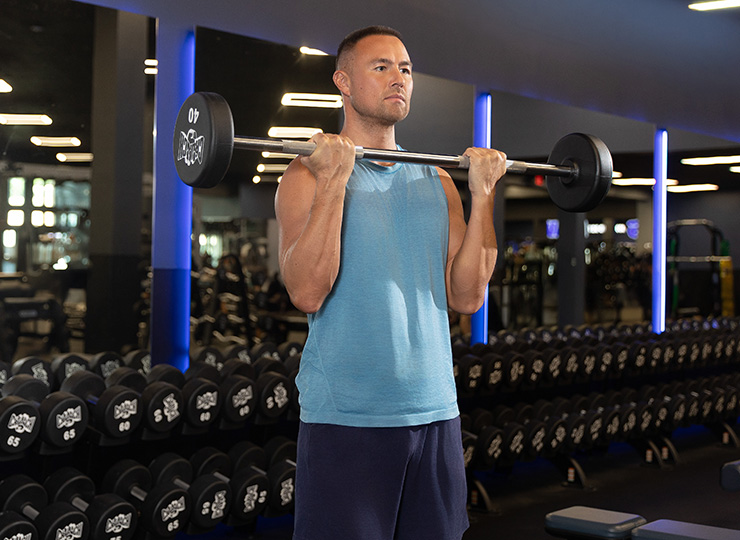 gym-goer lifting weight with arms