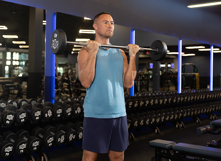 gym-goers lifts weights with arms