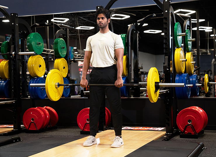 gym-goer barbell back squat