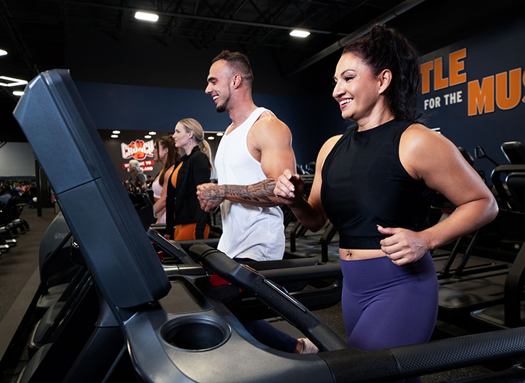 gym goers on treadmill