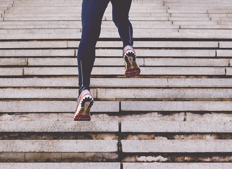 Woman running up the stairs