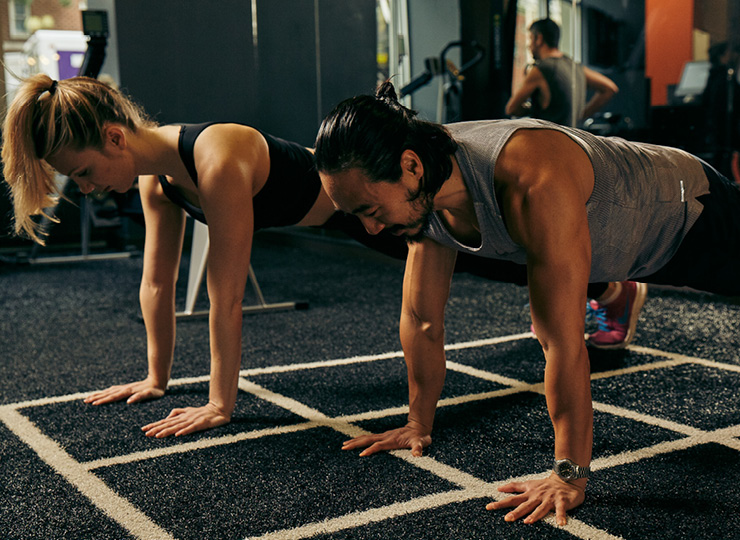 Man and woman doing push ups