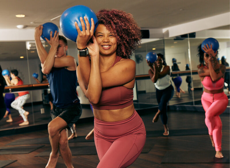 women with balls in a class