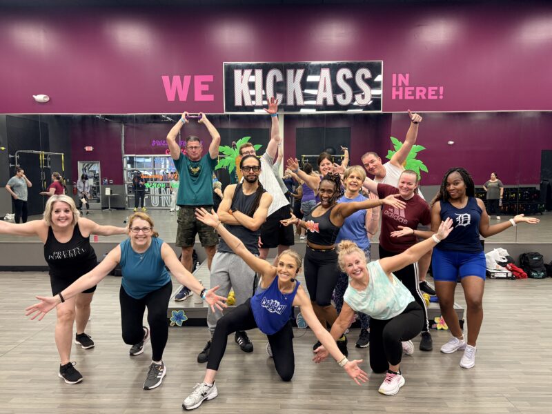 Gym-goers posing at Augie's quest event