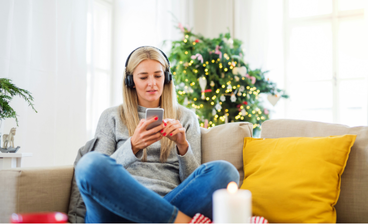 women in headphones and on phone
